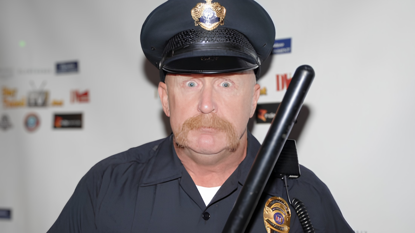 Al Burke: The Pro Wrestler Adam Sandler Handpicked Former professional wrestler Al Burke in police officer uniform, the tough-looking cop persona his Hollywood agent built for him that led to over 1,000 acting roles.