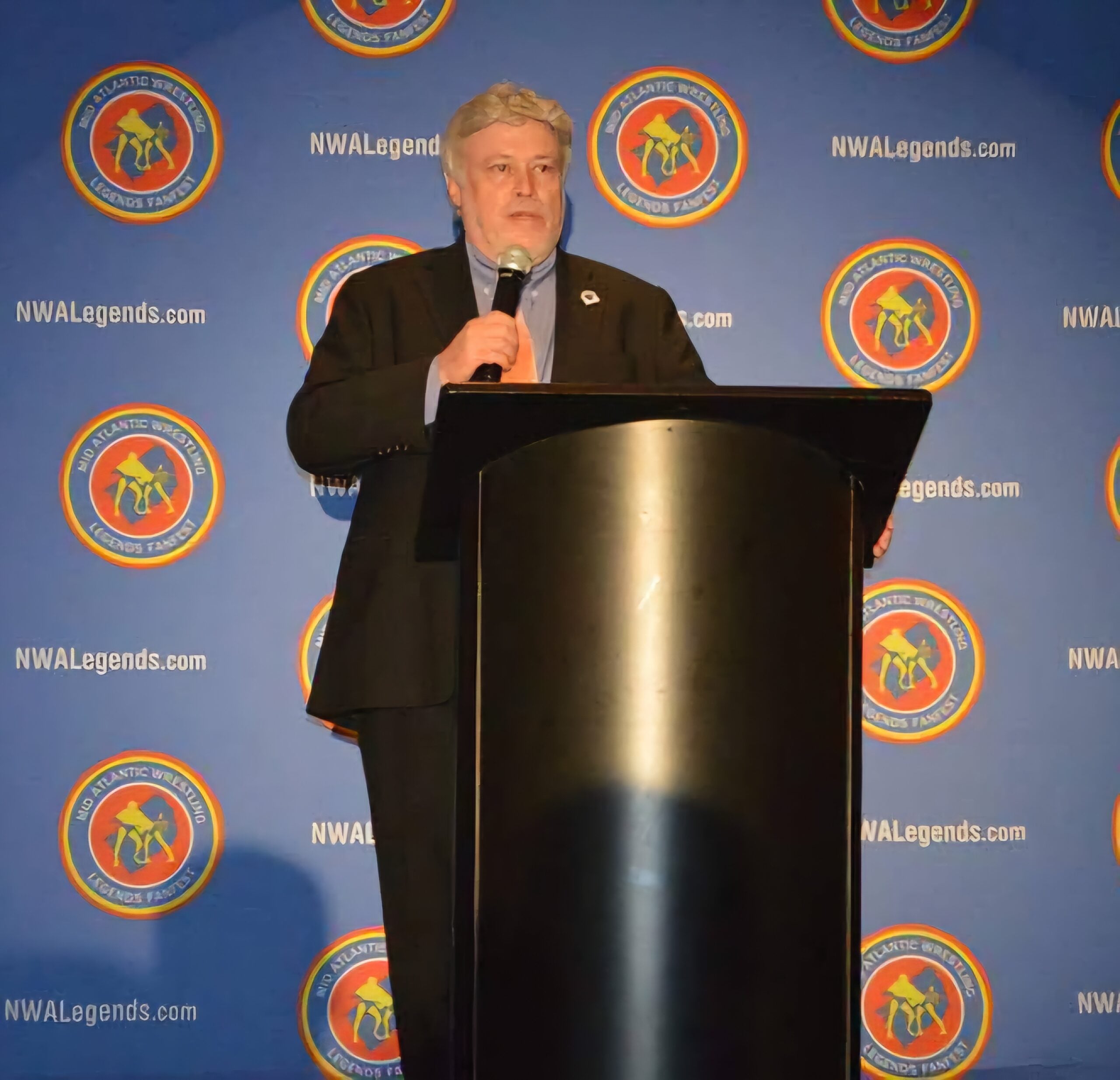 Mike Mooneyham at an NWA Hall of Heroes event, reflecting on the wrestlers and territory figures he covered and lost over decades in the business.