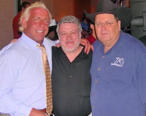 Mike Mooneyham poses with Ric Flair and Jim Ross, two of the wrestling legends who came to trust Mooneyham's reporting over decades of coverage.