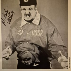 Vintage 1987 official WWF press promo photo of Nikolai Volkoff in his iconic Soviet ring jacket and fur hat, hand-signed in black marker. A fixed, non-renewable piece of memorabilia from the late WWE Hall of Famer, who passed away in 2018.