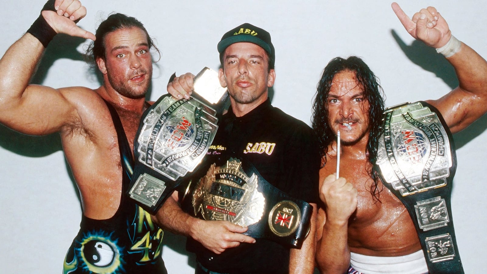 ECW on TNN: The Deal That Doomed a Wrestling Revolution Rob Van Dam and Sabu with manager Bill Alfonso pose as ECW World Tag Team Champions at an ECW event August 4, 1998.