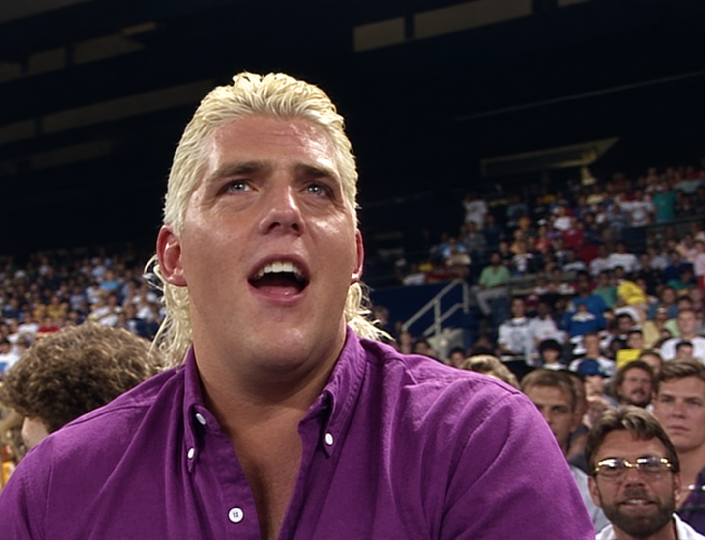 Dusty Rhodes leaves his match with Randy Savage to help Dustin Rhodes at ringside in 1990.